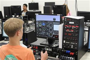 Student Flying in Flight Sim 
